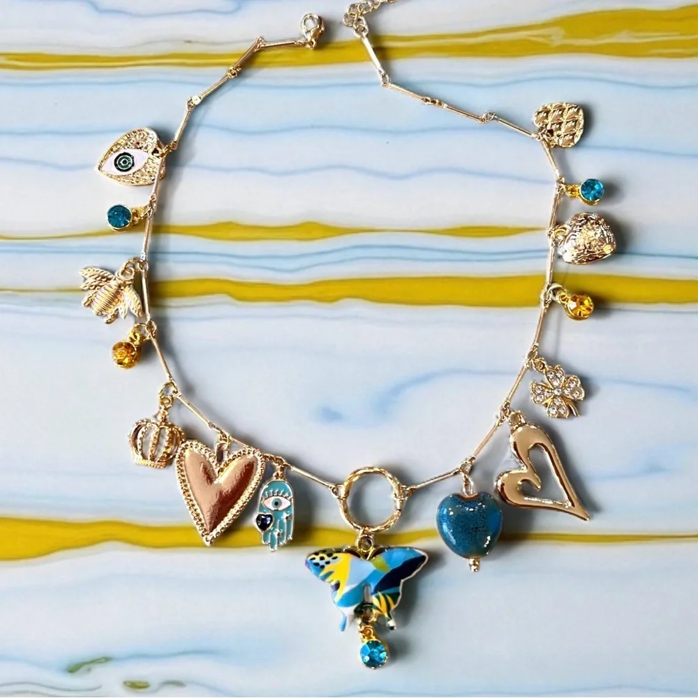 Unique and Gorgeous Gold toned Necklace with Varying Blue and Yellow Charms